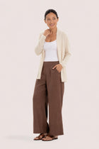 Woman wearing the natural cashmere Klarr outerwear by By The Sea Bali