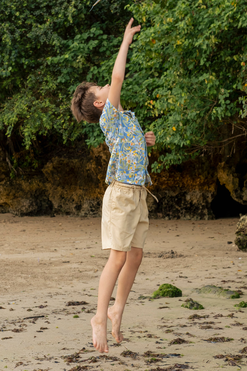 Relaxed resort styling featuring the Koda Boys Cotton Bermuda in Beige