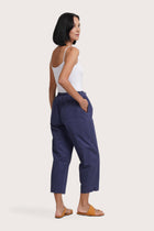 Back view of the Ladies Cropped Cotton Pants Navy highlighting the garment shape and drape.