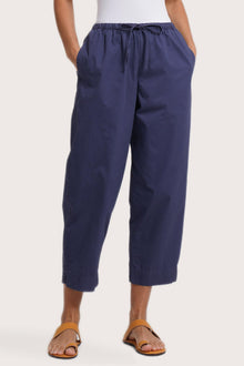 Close up detail of the Ladies Cropped Cotton Pants Navy highlighting craftsmanship and design features.