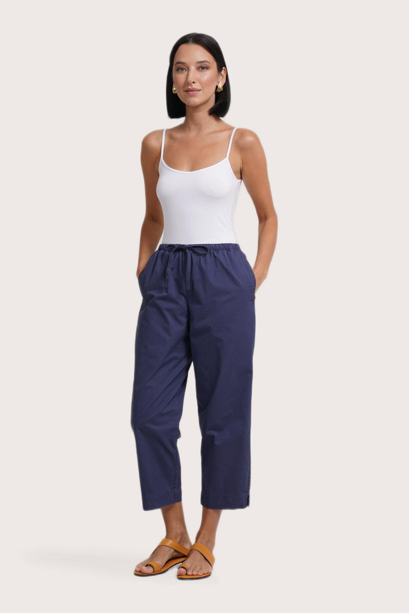 Side profile of the Ladies Cropped Cotton Pants Navy showing its cut and natural movement.