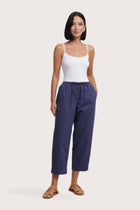 Woman wearing the Ladies Cropped Cotton Pants Navy designed for effortless resortwear and tropical living by By The Sea Bali.