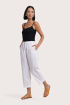 Side profile of the Ladies Cropped Cotton Pants White showing its cut and natural movement
