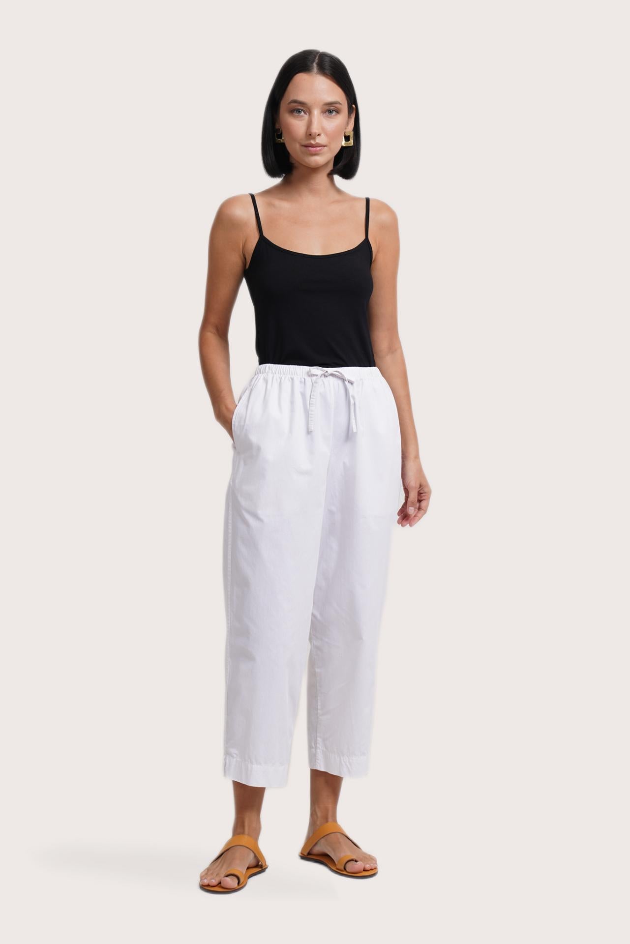 Woman wearing the Ladies Cropped Cotton Pants White designed for effortless resortwear and tropical living by By The Sea Bali.