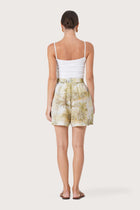 Back view of the Laica Linen Short The island Multicolor White Base highlighting the garment shape and drape
