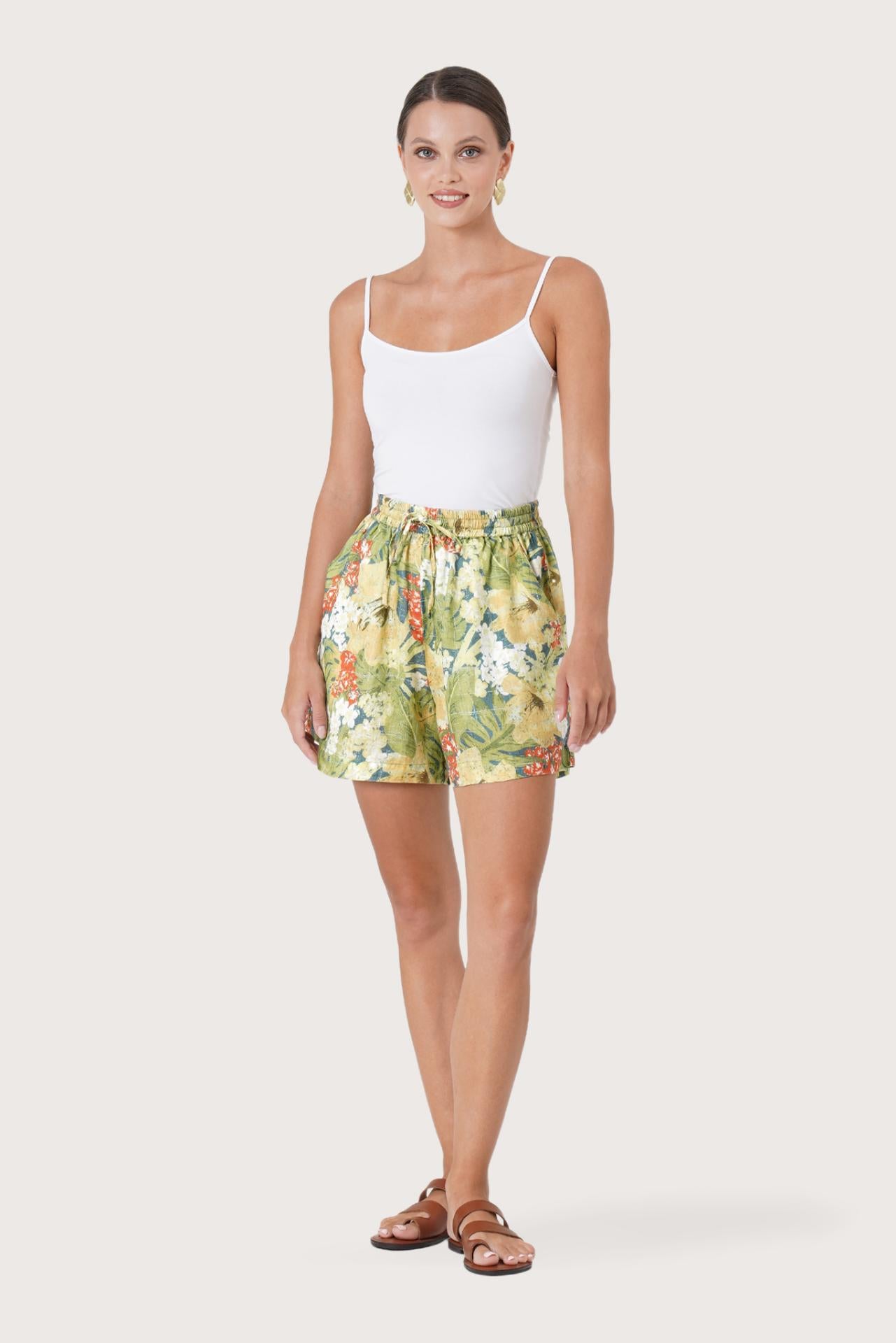 Woman wearing the Laica Linen Short Tropis Multicolor White Base  designed for effortless resortwear and tropical living by By The Sea Bali