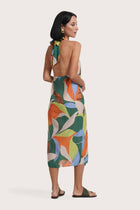 Back view of the Laila Wrap Dress Magical Flora Green showing its cut and natural movement