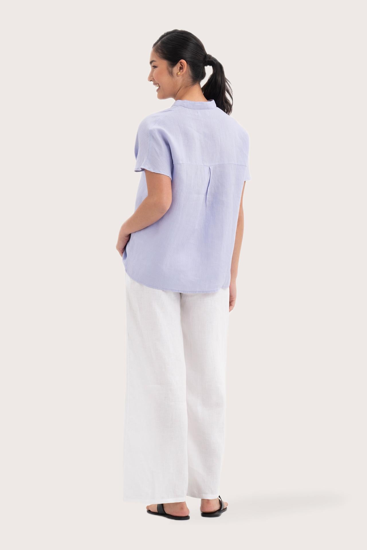 Back view of the Laluna linen Shirt Lavender highlighting the garment shape and drape.