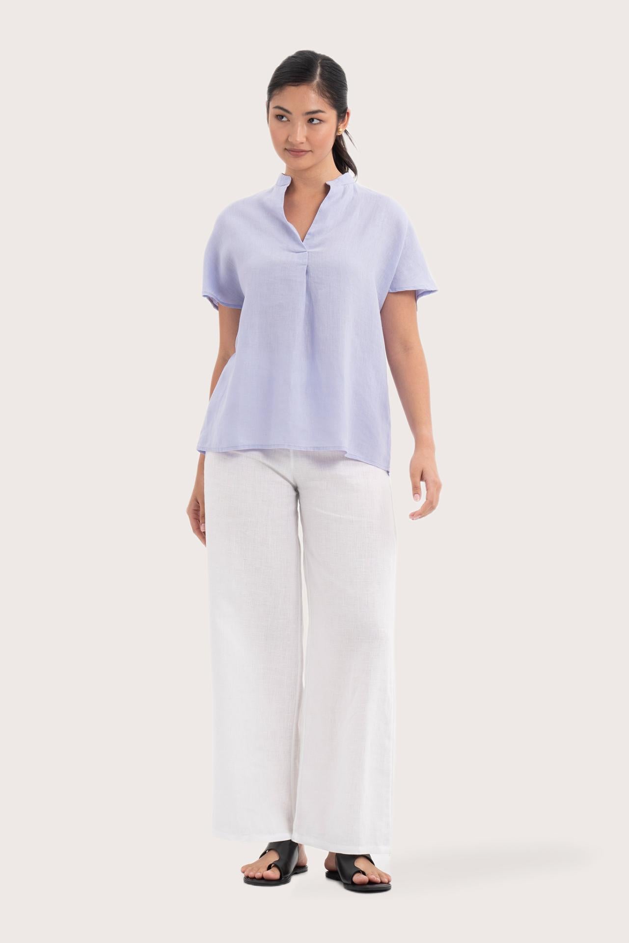 Woman wearing the Laluna linen Shirt  Lavender designed for effortless resortwear and tropical living by By The Sea Bali.
