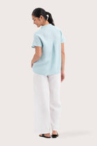 Back view of the Laluna linen Shirt light Green highlighting the garment shape and drape.