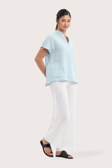 Side profile of the Laluna linen Shirt Light Green showing its cut and natural movement.