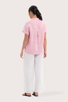 Back view of the Laluna linen Shirt light Pink highlighting the garment shape and drape.
