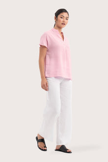 Side profile of the Laluna linen Shirt Light Pink showing its cut and natural movement.