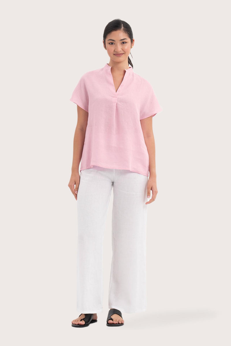 Woman wearing the Laluna linen Shirt  Light Pink designed for effortless resortwear and tropical living by By The Sea Bali.