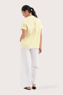 Back view of the Laluna linen Shirt Light Yellow highlighting the garment shape and drape.