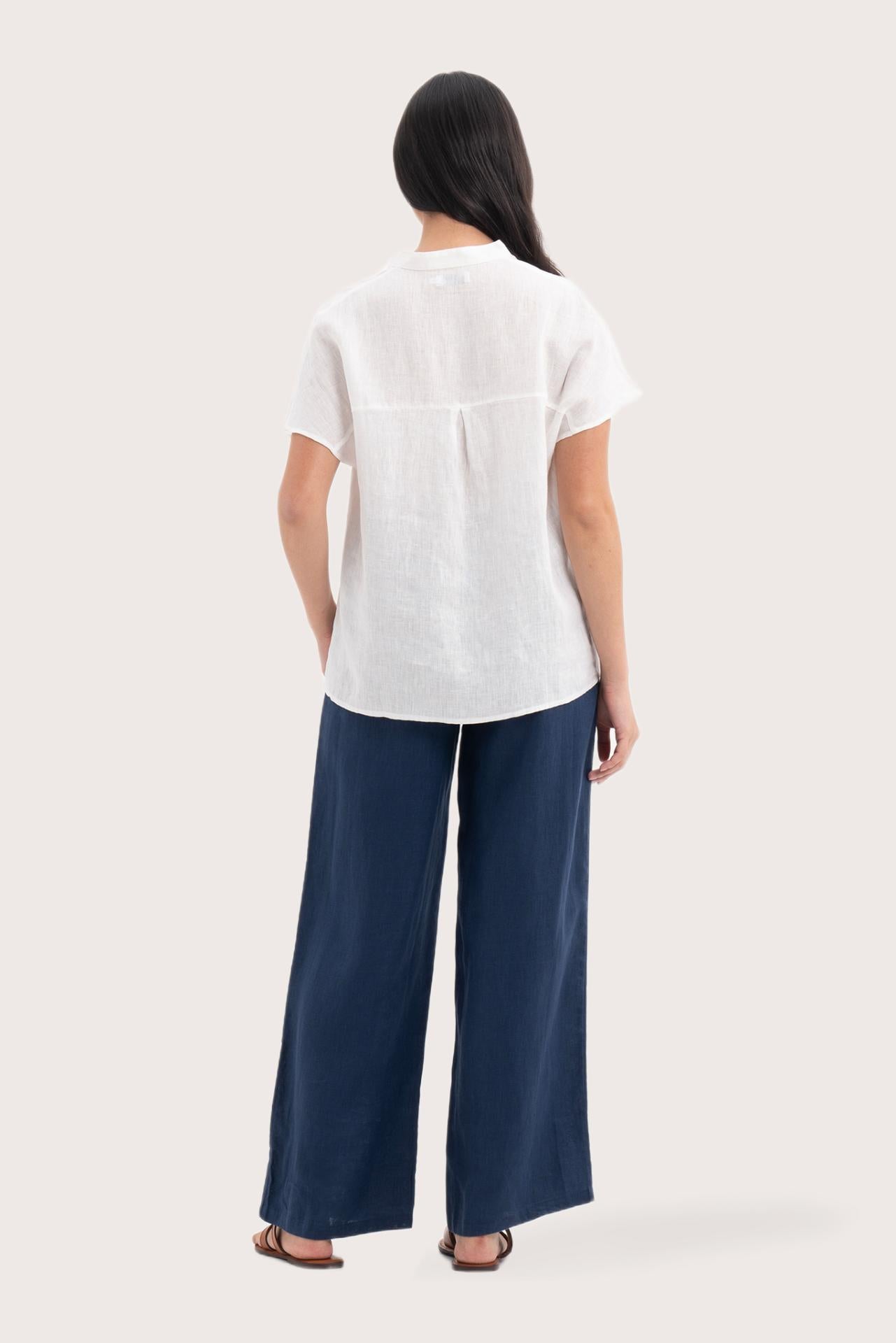 Back view of the Laluna linen Shirt Off White highlighting the garment shape and drape.