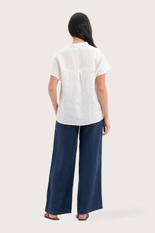 Back view of the Laluna linen Shirt Off White highlighting the garment shape and drape.