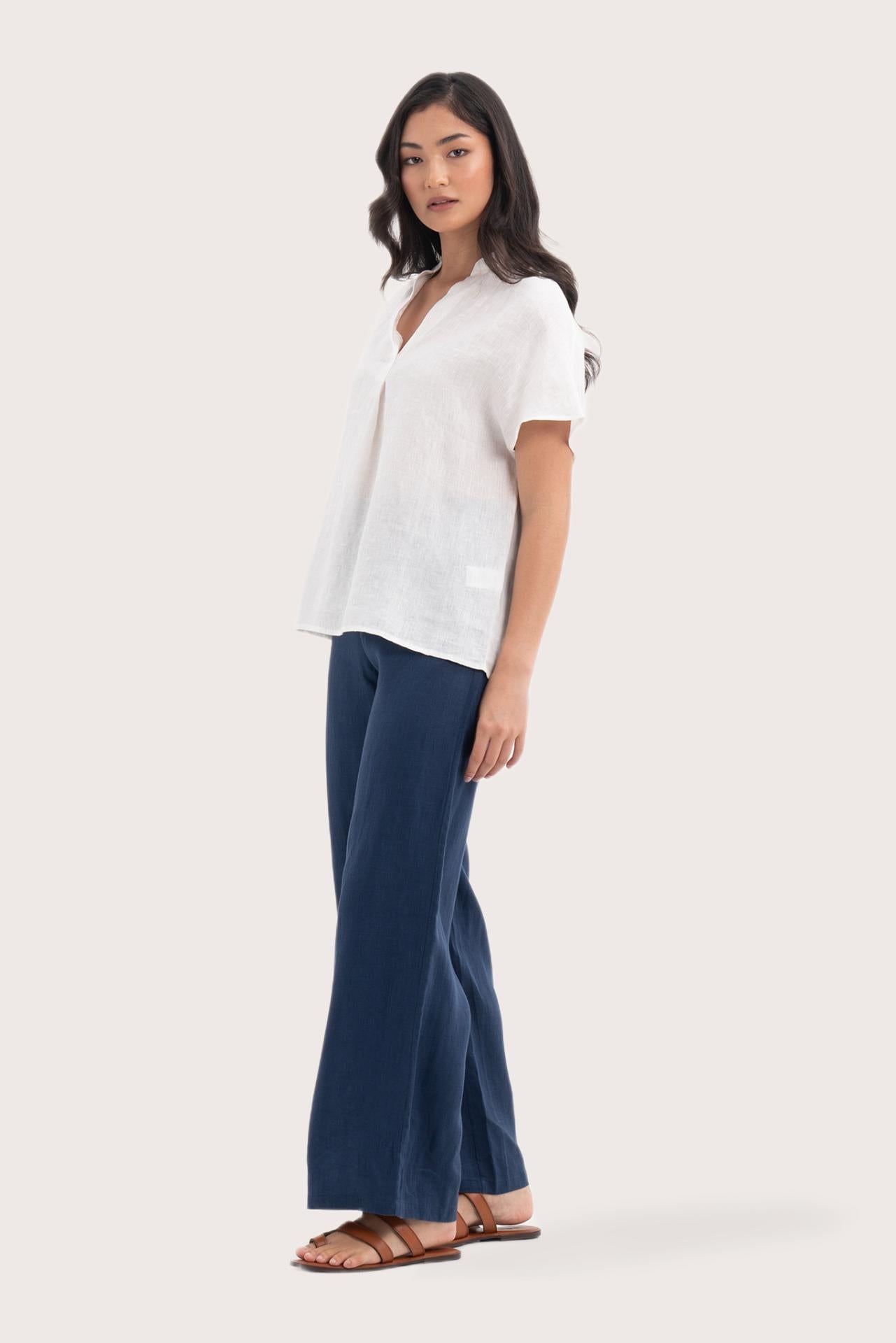 Side profile of the Laluna linen Shirt Off White showing its cut and natural movement.