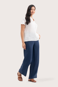 Side profile of the Laluna linen Shirt Off White showing its cut and natural movement.