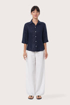 By The Sea Bali Laura Linen Shirt in Navy featuring a relaxed silhouette and timeless resort style for effortless coastal dressing