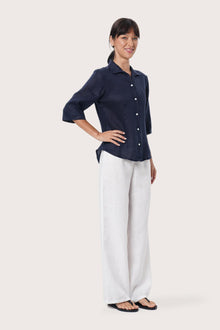 By The Sea Bali Side profile of the Laura Linen Shirt showcasing its relaxed fit and fluid drape