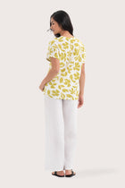 Back view of the Lenore Printed Top Flower Green highlighting the garment shape and drape.