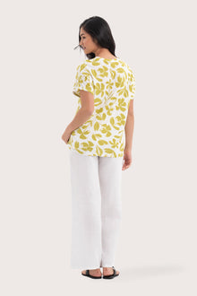 Back view of the Lenore Printed Top Flower Green highlighting the garment shape and drape.