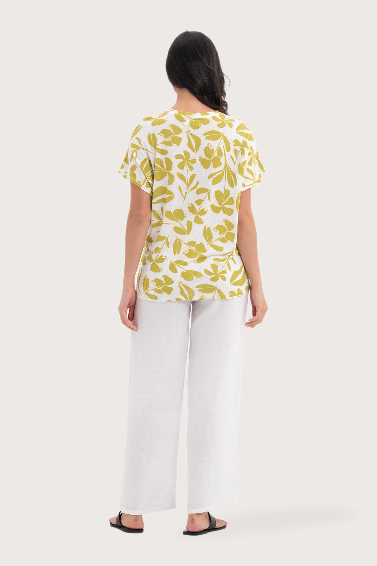 Back view of the Lenore Printed Top Flower Green highlighting the garment shape and drape.
