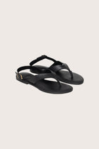 Levi sandal in black front view showcasing sleek straps and minimalist resort aesthetic