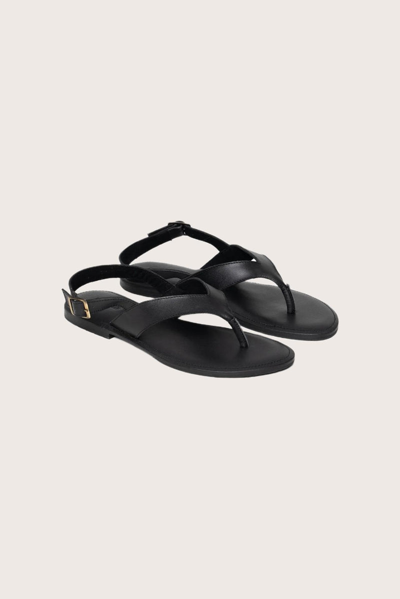 Levi sandal in black front view showcasing sleek straps and minimalist resort aesthetic