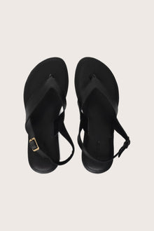 Levi sandal in black shown in a global view highlighting its full silhouette and refined resort design