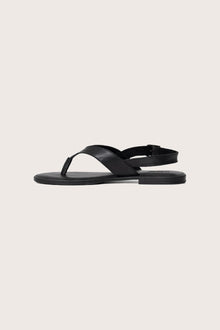 Side profile of Levi sandal in black highlighting modern, streamlined resort footwear silhouette