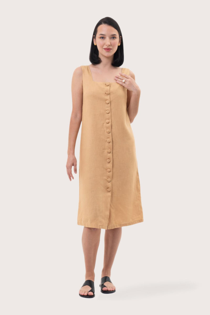 Woman wearing the Linda Front Button Midi Linen Dress Pale Yellow designed for effortless resortwear and tropical living by By The Sea Bali