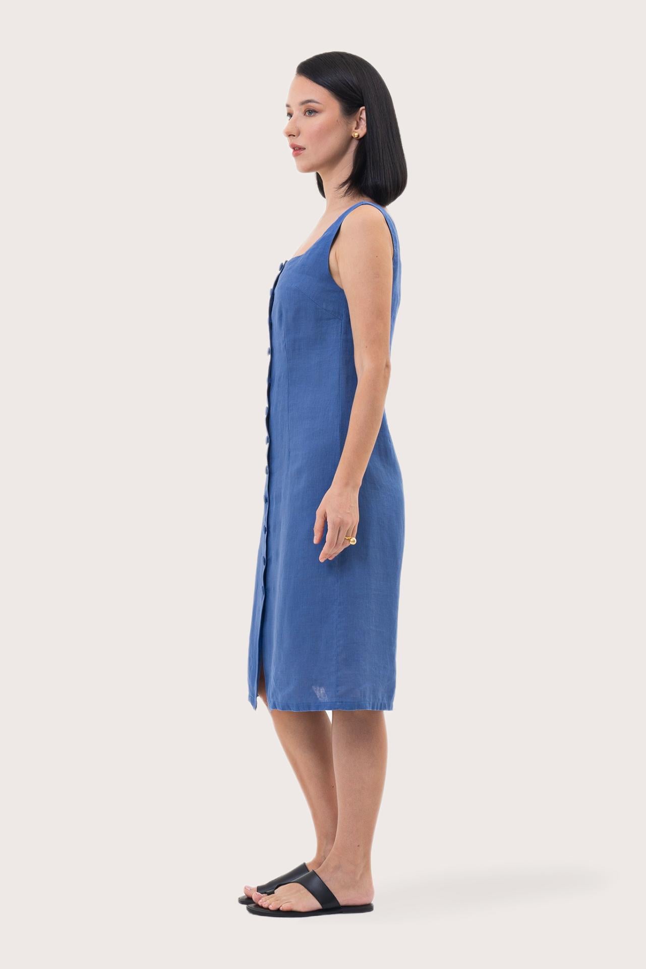 Side profile of the Linda Front Button Midi Linen Dress Royal Blue showing its cut and natural movement