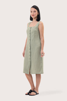 Side profile of the Linda Front Button Midi Linen Dress Sage showing its cut and natural movement