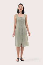 Woman wearing the Linda Front Button Midi Linen Dress Sage designed for effortless resortwear and tropical living by By The Sea Bali