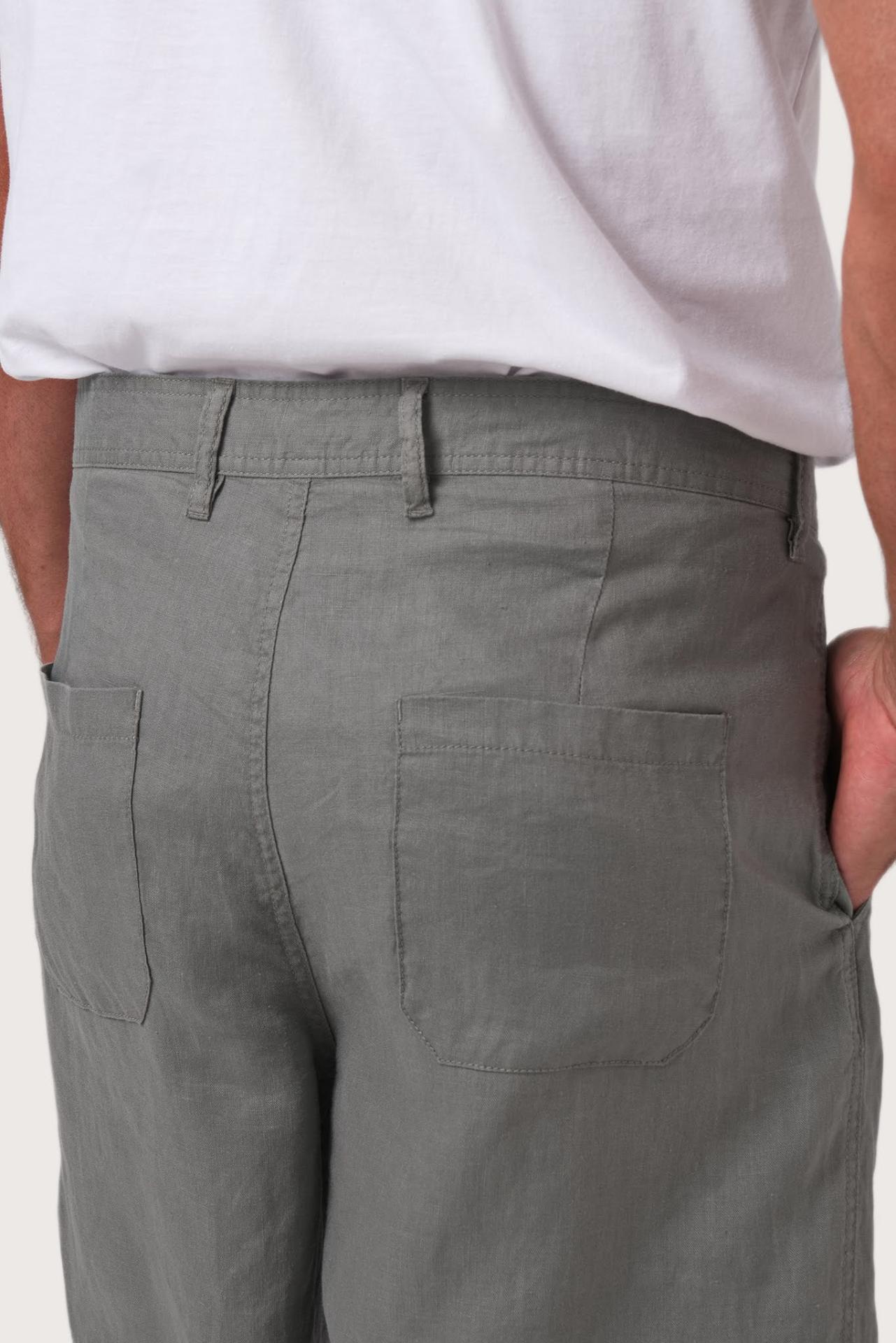 Detailed back view highlighting the relaxed silhouette and linen craftsmanship