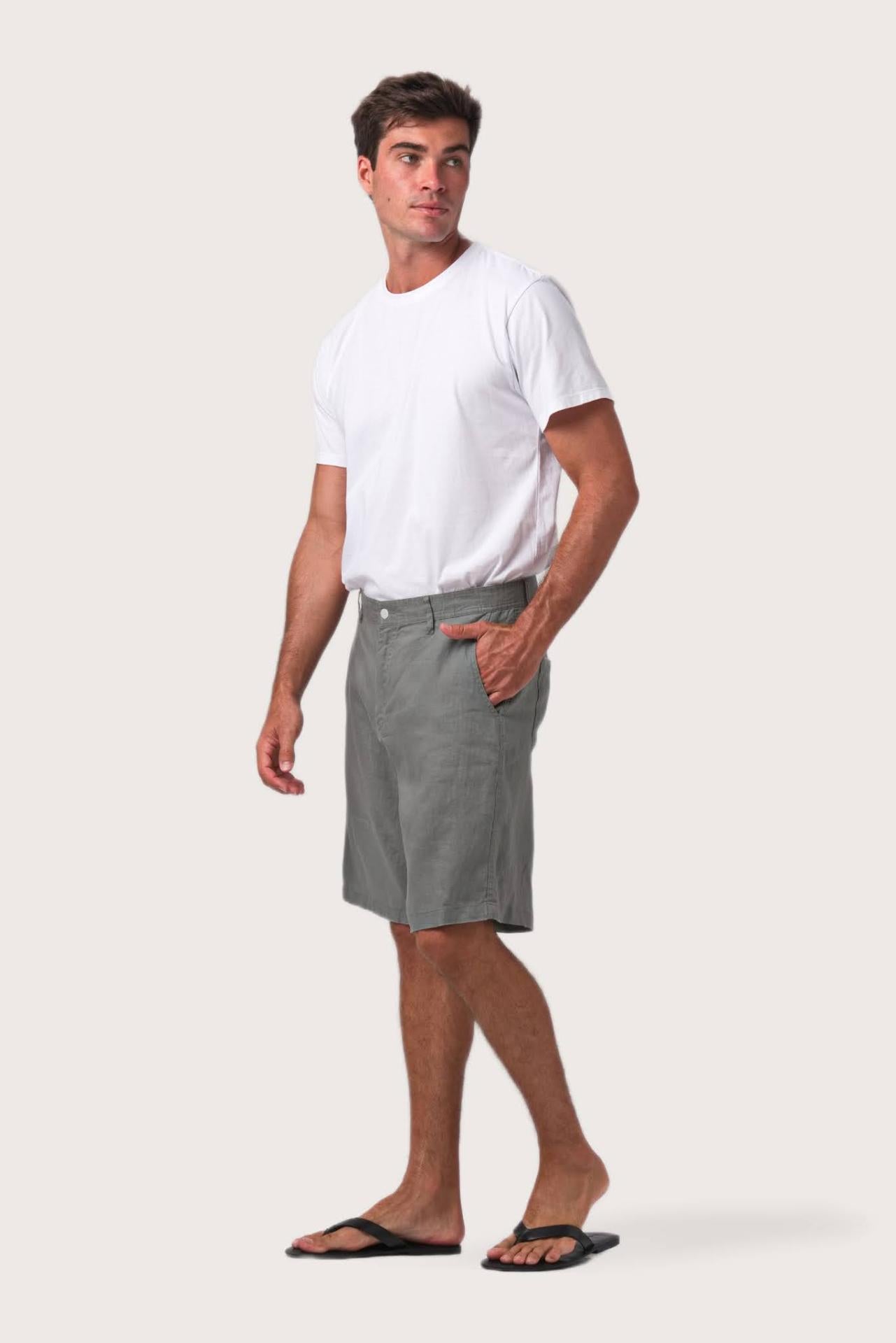 Side profile of the grey linen bermuda shorts showcasing their effortless fit