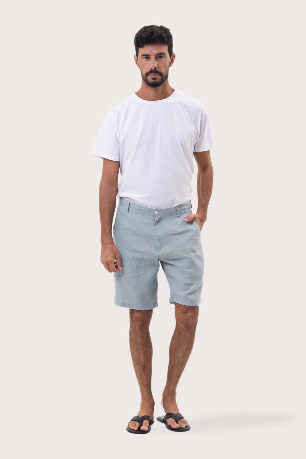 Model wearing the light blue linen bermuda shorts by By The Sea Bali