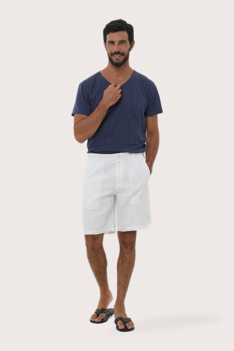 Model wearing the white linen bermuda shorts by By The Sea Bali