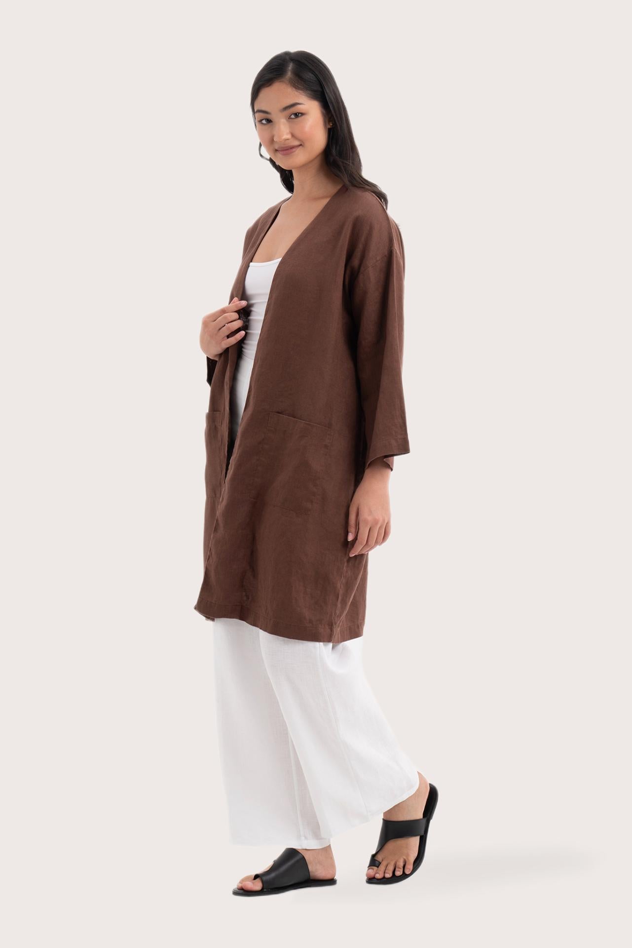 Side profile of the Linen Haori Outerwear Mahogany showing its cut and natural movement