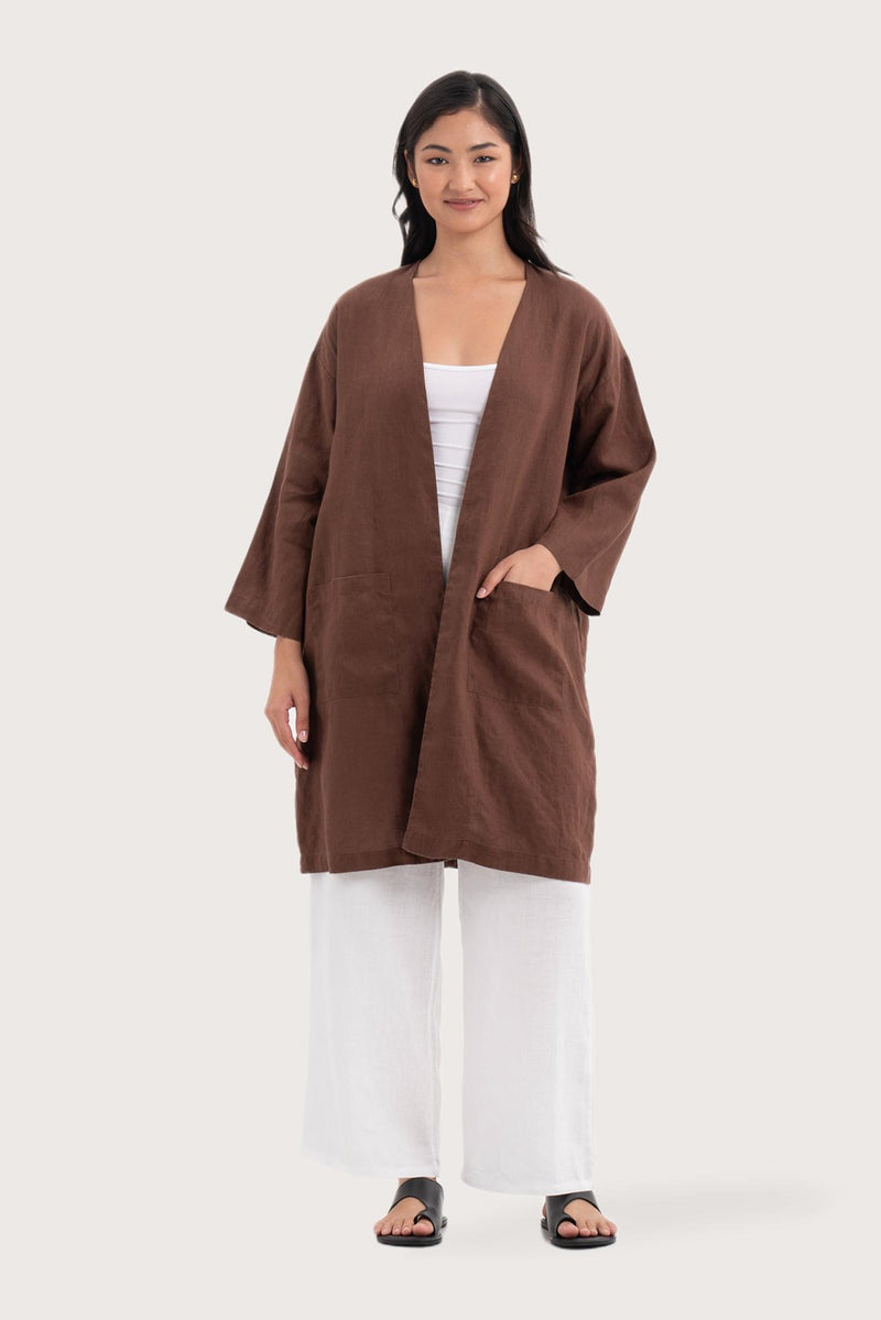 Woman wearing the Linen Haori Outerwear Mahogany designed for effortless resortwear and tropical living by By The Sea Bali