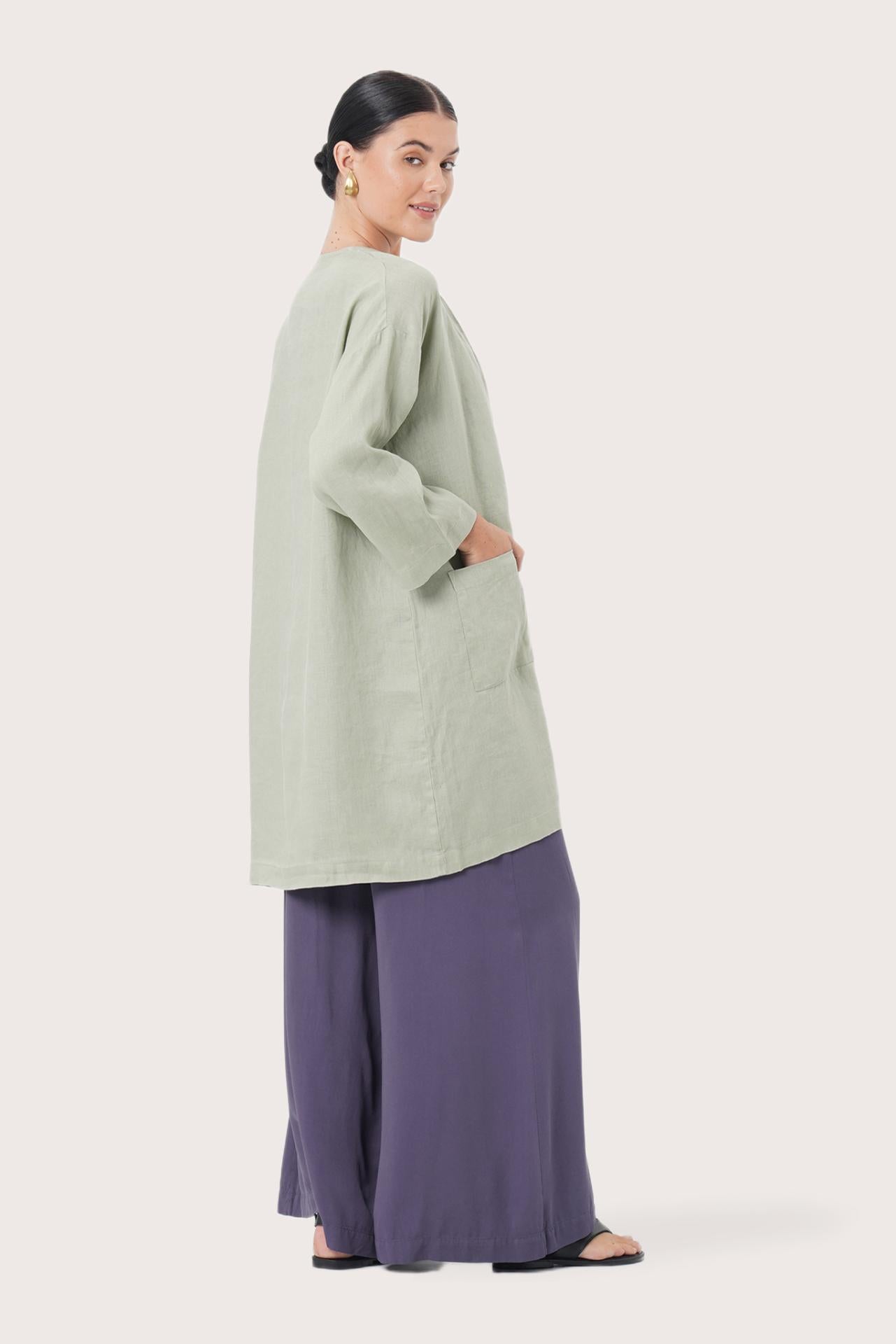 Back view of the Linen Haori Outerwear Sage highlighting the garment shape and drape.