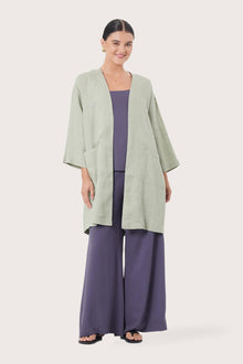 Woman wearing the Linen Haori Outerwear Sage designed for effortless resortwear and tropical living by By The Sea Bali