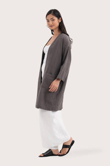 Side profile of the Linen Haori Outerwear Stone showing its cut and natural movement