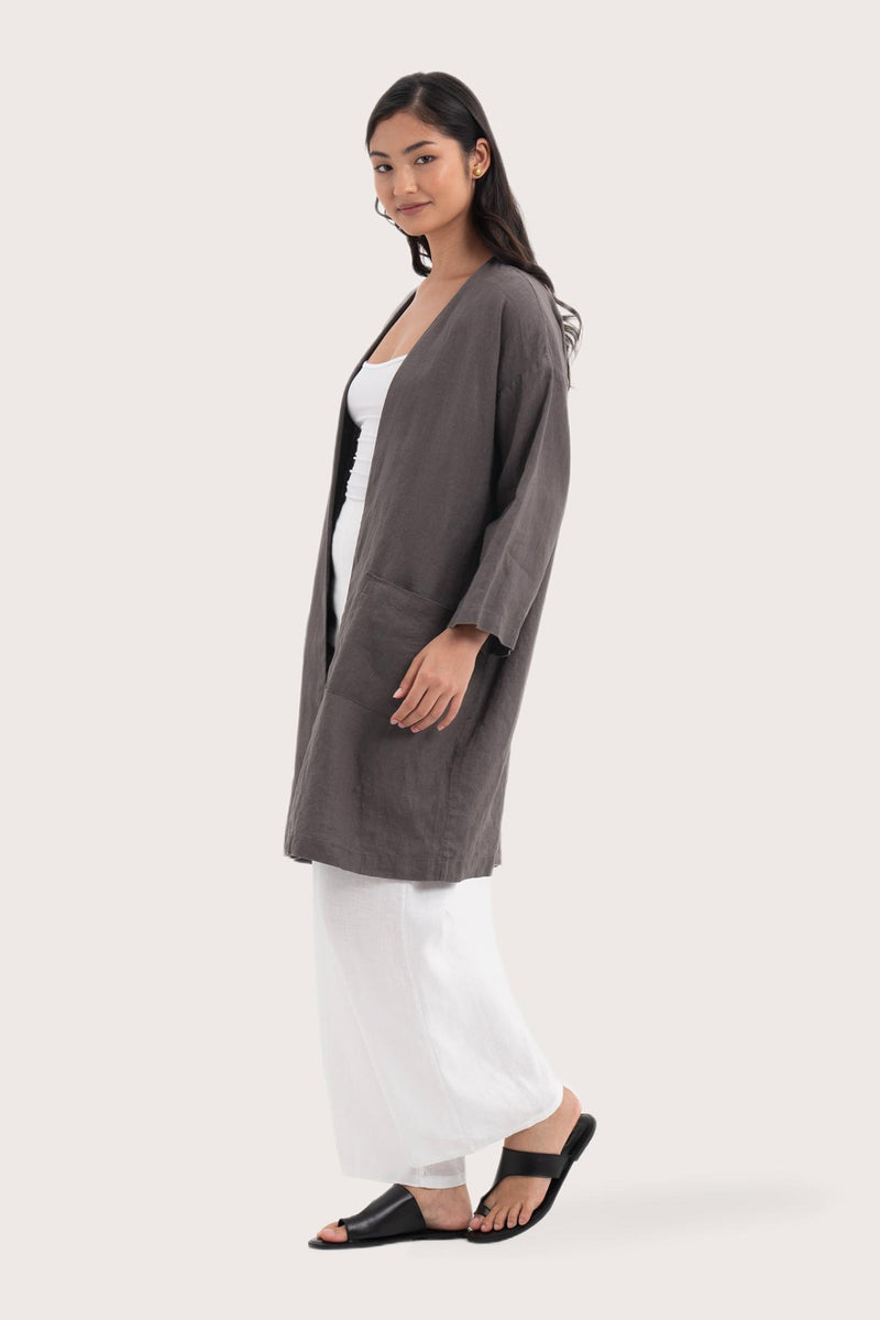 Side profile of the Linen Haori Outerwear Stone showing its cut and natural movement
