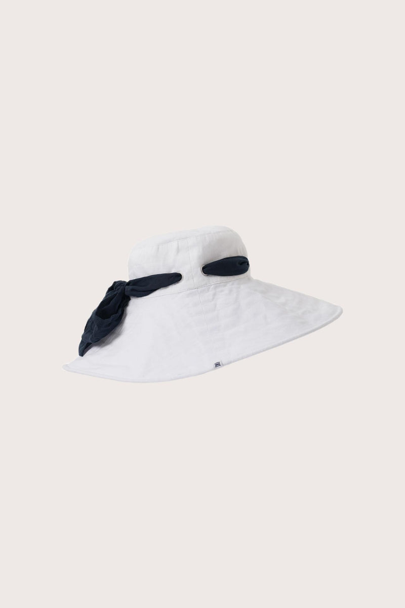 Side view of the Linen Hat With Snood Off White highlighting its soft linen construction and protective drape