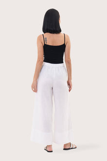 Back view of the Linen Maxi Length Wide Pants White highlighting the garment shape and drape.