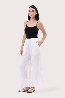 Side profile of the Linen Maxi Length Wide Pants White showing its cut and natural movement.