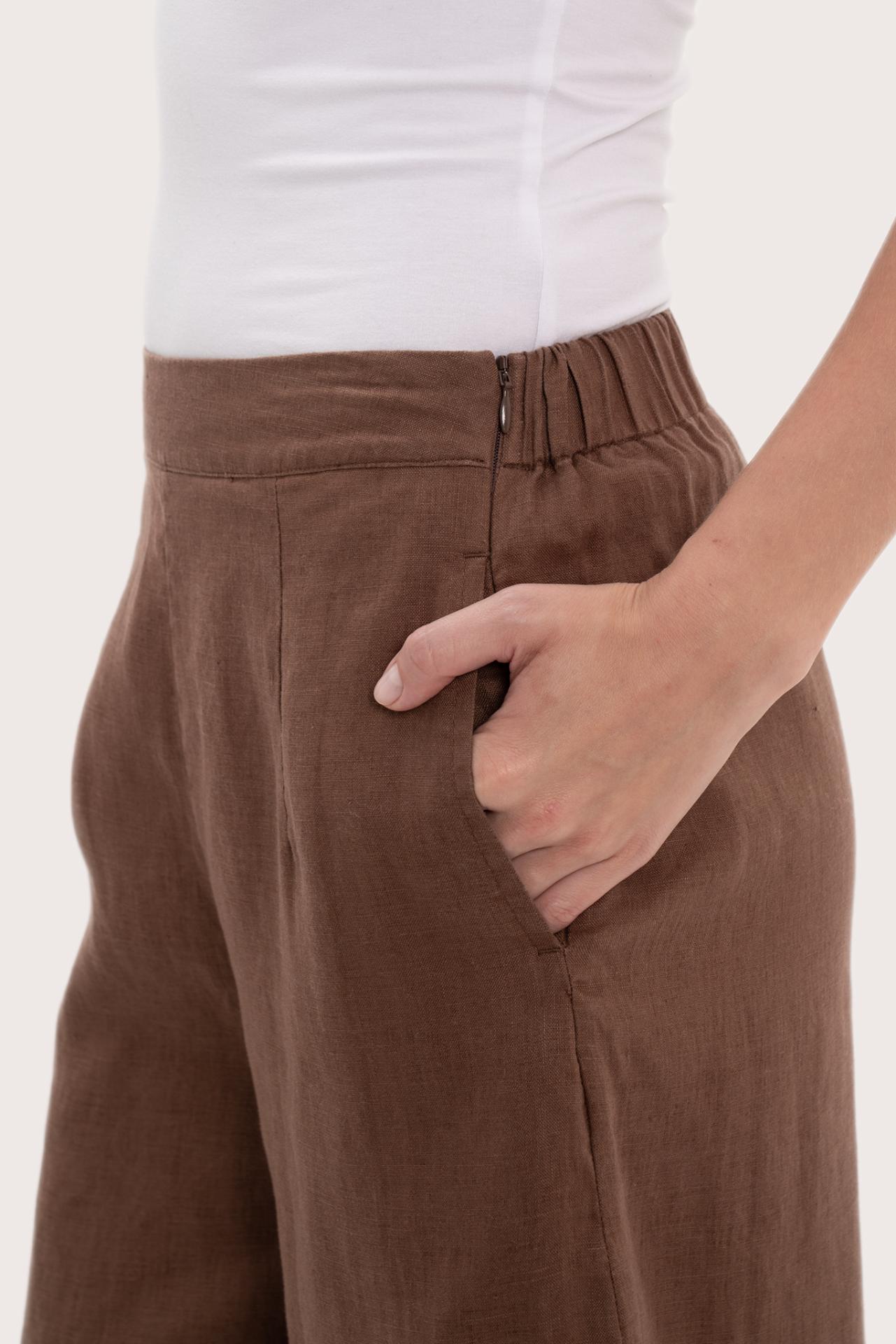 Close-up texture of the breathable linen fabric and garment construction